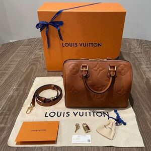 LOUIS VUITTON Monogram Empreinte Speedy Bandouliere 25 in Cognac